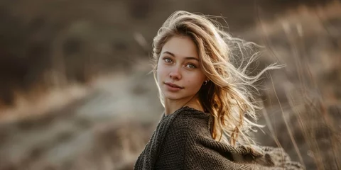 Foto op Canvas Beautiful Nordic Woman her hair is tousled and wild with playful expression wear black fabric cloth standing against natural rugged landscape created with Generative AI Technology © Sentoriak