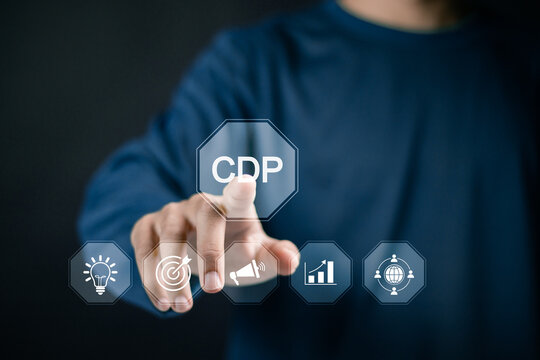 CDP, Customer Data Platform concept. Customer data for analysis, collection Customer information and martech tools. Businessman touching CDP icon on virtual screen.
