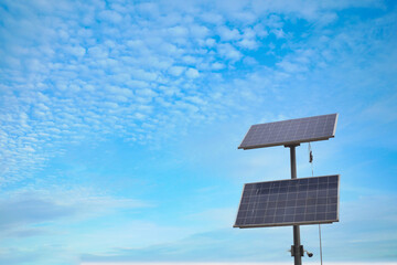 Solar pannels at street against blue sky 