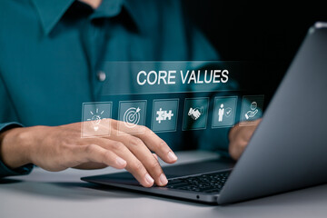 Core values responsibility ethics goals company concept. Businessman using laptop with Core Values...