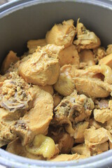 Indonesian food called ayam ungkep in an aluminum container