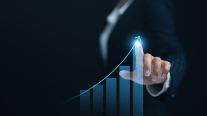 Businesswoman touches arrow graph business growth analyzing company growth, future, and development...