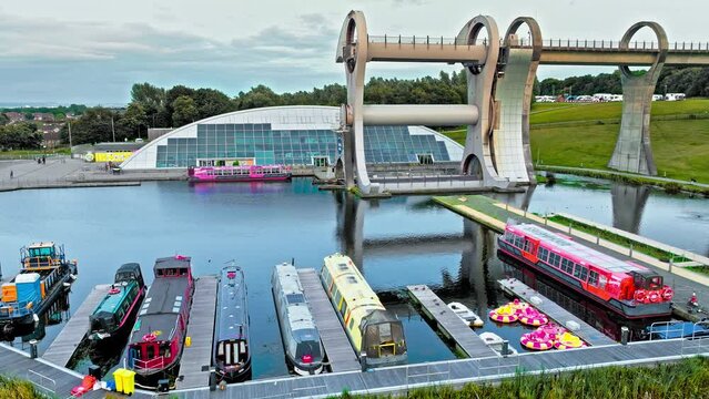 Aerial view of The Falkirk Wheel,  tourist attraction in Falkirk, Scotland. Rotating boat lift connecting the Forth and Clyde Canal with the Union Canal with ships and boats.