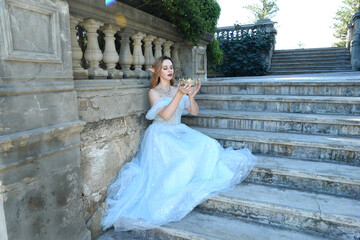 full length portrait of beautiful female model wearing blue fantasy ballgown, like a fairytale elf...