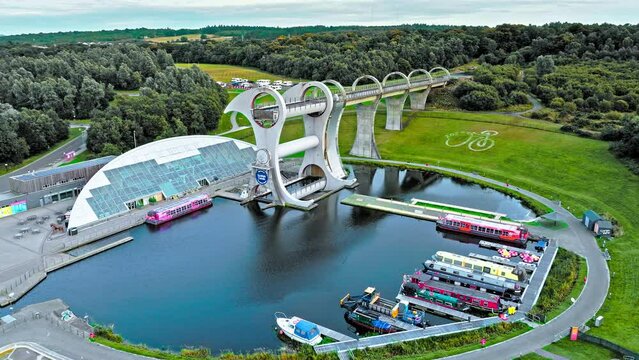 Aerial view of The Falkirk Wheel,  tourist attraction in Falkirk, Scotland. Rotating boat lift connecting the Forth and Clyde Canal with the Union Canal with ships and boats.
