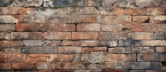 Obraz premium A detailed shot of a brick wall showcasing the building material, brickwork, and composite material used to construct the fixture. The bricks create a beautiful pattern resembling a work of art