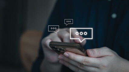 Online communication and social media content marketing concept. Person using mobile smartphone for chat and receive notification icons of message comment.