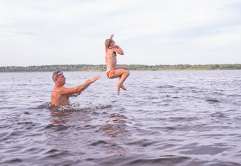 People frolic in the water on a hot, sunny summer day. 