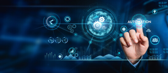 Automation concept, Manager engineer touching the Automation icon on a machine on modern virtual interface data in real time in an intelligent factory, Manufacturing industrial digital.