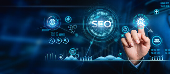 SEO (search Engine optimization) Marketing concept. Businessman touches the word SEO in his hand...