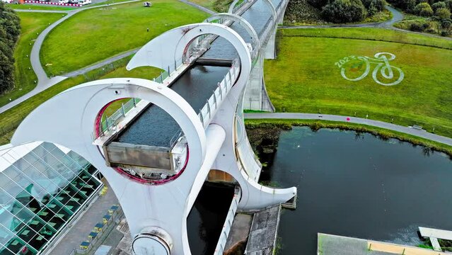 Aerial view of The Falkirk Wheel,  tourist attraction in Falkirk, Scotland. Rotating boat lift connecting the Forth and Clyde Canal with the Union Canal with ships and boats.
