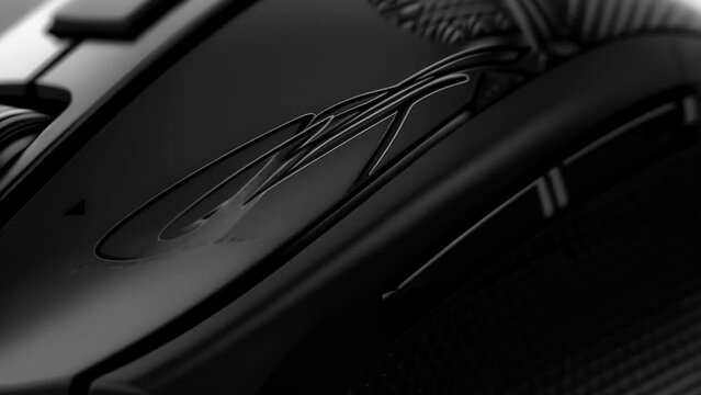 A detailed image of a fans personalized gaming mouse signed by an influencer with their nickname etched into the sleek black surface.