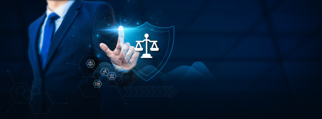 Businessman hand touching a legal tech protection shield. Legal security concept to safeguard businesses and individuals from accidents and unexpected legal challenges.