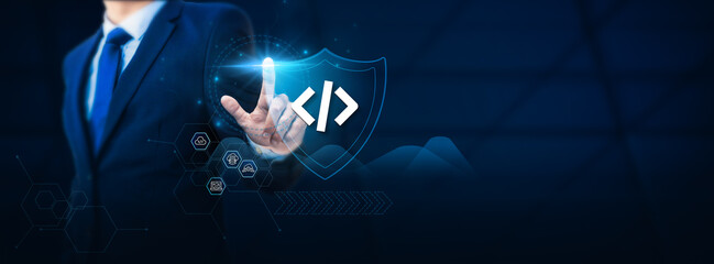 Programmer's hand touches a protective shield representing a safety network. The concept of...