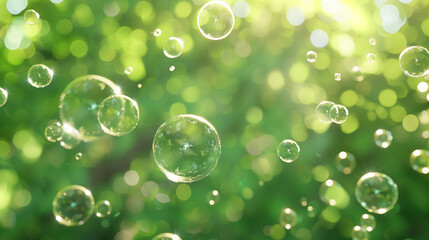Multiple soap bubbles floating in the air on a sunny day, green backdrop with plants. Copy space. Backdrop, background.