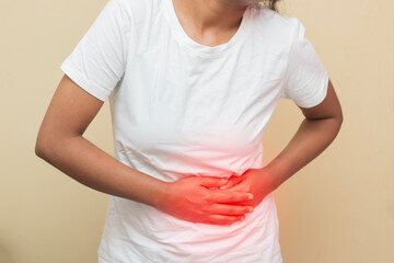 imitative presentation of a Indian lady feeling stomach pain. 