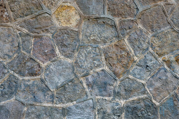 Background from an old wall made of natural stone