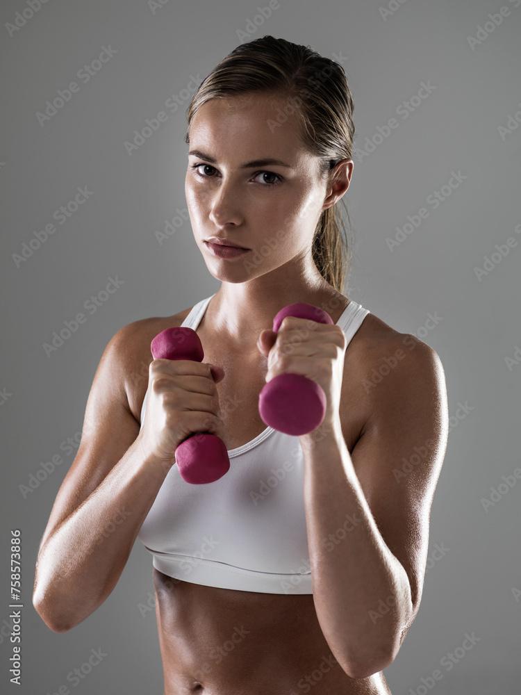 Sticker Serious woman, portrait and workout with dumbbells for fitness, weightlifting or exercise on a gray studio background. Female person, bodybuilder or athlete with small barbells for training on mockup