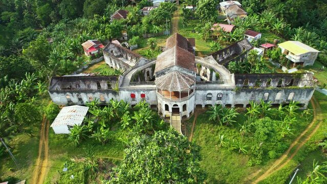 Drone flying away from a Old Hospital in Ro&ccedil;a Agua Iz&eacute;, Sao Tome and Principe