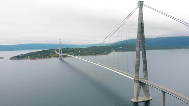 Aerial: H&aring;logaland Bridge seen from the Ofotfjord in Narvik and some cars crossing it