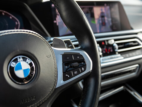 Novosibirsk, Russia - March  13 , 2024:  BMW X7,  Car controller on steerling wheel ,Music,Control System Function and voice telephone in car. modern car interior