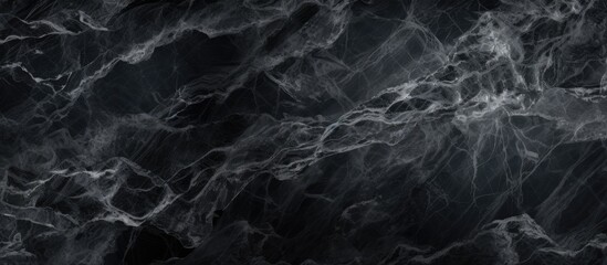 A close up of a grey marble texture with white veins resembling a celestial astronomical object in darkness, displaying a unique pattern similar to wind waves in liquid