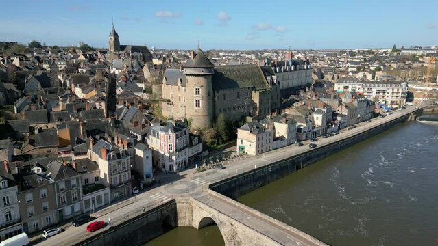 Laval Castle and old bridge, Mayenne department, France. Aerial drone view and cityscape