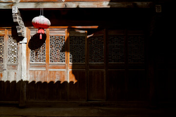 Asian old Ming and Qing architecture houses with hanging lanterns. Translation: blessing