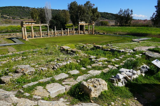 Brauron or Vravrona, Attica, Greece. The ancient sanctuary of Artemis, columns of the arcade or stoa and ruins of the temple