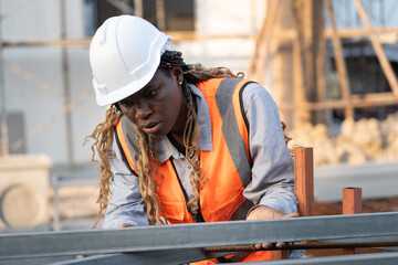 Worker engineer African woman working at construction site	 - 758590869
