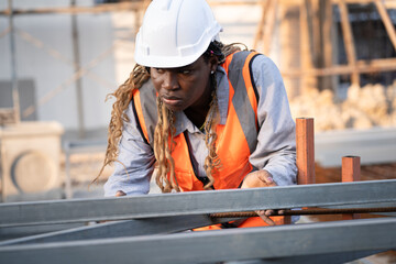 Worker engineer African woman working at construction site	 - 758590873