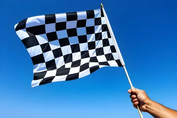 Foto op Canvas checkered flag on blue sky background © Nyetock