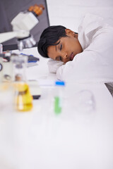 Nap, tired and woman scientist in laboratory working overtime on pharmaceutical research. Exhausted, fatigue and female biology researcher with sleeping for burnout with medical project or study.