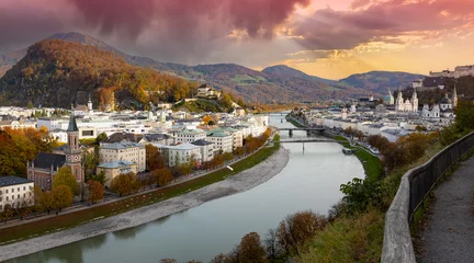 Fotobehang Autumn season at a historic city of Salzburg with Salzach river in beautiful sunset sky and colorful of autumn scene Salzburger Land, Austria © SASITHORN