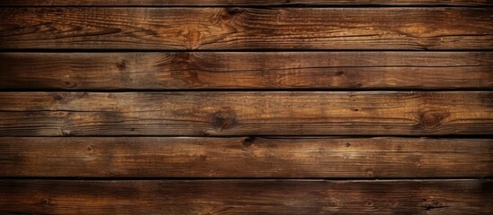 Fototapeta na wymiar A closeup shot of a brown hardwood plank wall with a blurred background, showcasing the natural wood grain pattern and tints and shades of the wood stain