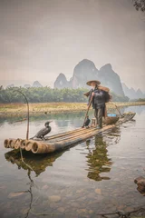 Cercles muraux Guilin Sailing peacefully across a river, Guilin cormorant fishermen set out on river