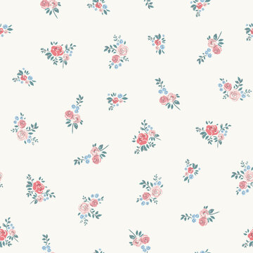 Delicate watercolor seamless pattern depicting pink, red and blue flowers with green leaves on a light background.