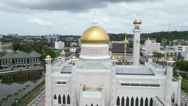 aerial drone shot of golden dome and minarets on the Sultan Omar Ali Saifuddien Mosque in Bandar Seri Bagawan in Brunei Darussalam
