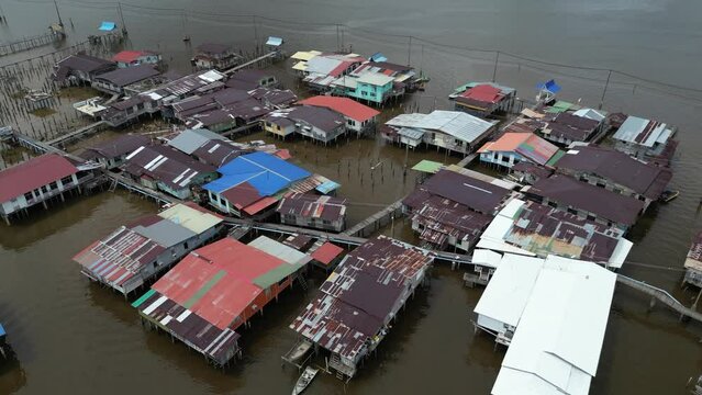 aerial drone shot of stilted homes and boardwalks in the floating villages of Kampong Ayer in Bandar Seri Bagawan in Brunei Darussalam
