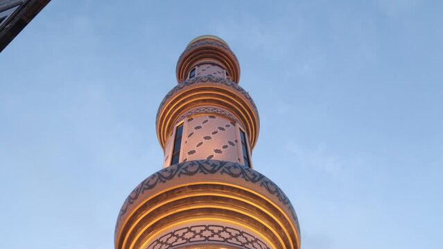 looking up at the intricate minaret of Jame' Asr Hassanil Bolkiah Mosque in Bandar Seri Bagawan in Brunei Darussalam at dusk