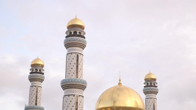 golden dome and tall minarets on the astonishing Jame' Asr Hassanil Bolkiah Mosque in Bandar Seri Bagawan in Brunei Darussalam