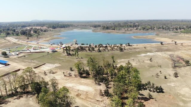 Aerial shot of beautiful park inaugurated by Hemant Soren in Lakshanpur dam in Chatra, Jharkhand, India with beautiful blue water lake.