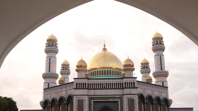 panning up at the elegant golden deisng of Jame' Asr Hassanil Bolkiah Mosque in Bandar Seri Bagawan in Brunei Darussalam