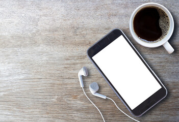 Smart phone and earphone with cup of coffee