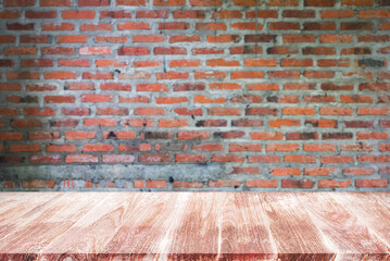 Empty top wooden shelves and stone brick wall background.