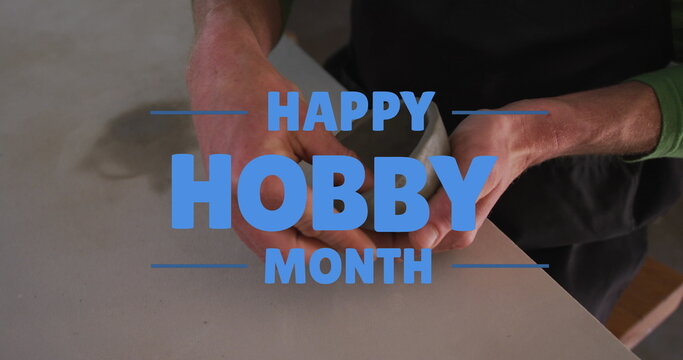 Image of happy hobby month text over caucasian man forming pottery - Powered by Adobe