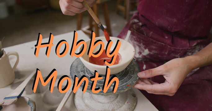 Image of hobby month over woman in pottery workshop - Powered by Adobe