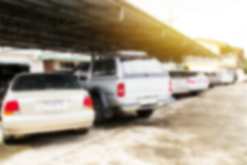 Defocused and blur image with morning sunlight of car park