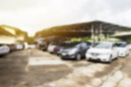 Defocused and blur image with morning sunlight of car park
