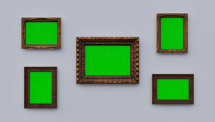 Blank frames with Green canvas on the bright wall in modern gallery interior